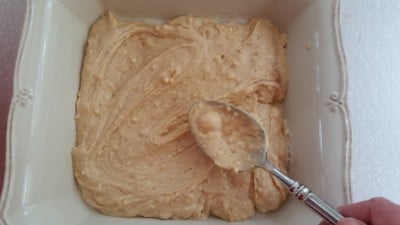 Pour cake batter into the greased baking dish.