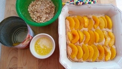 Top cake with peach slices.