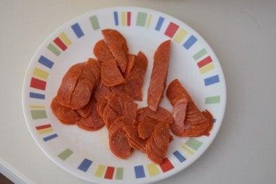 Chop up pepperoni.