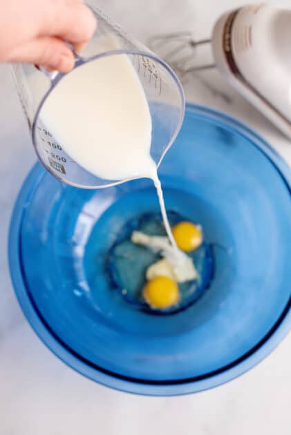 Add milk to mixing bowl.
