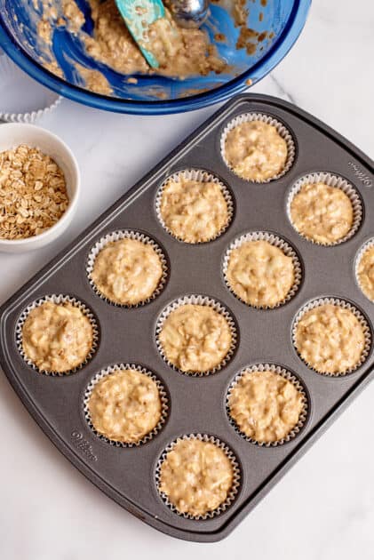 Scoop apple bran muffin batter into lined muffin tin.