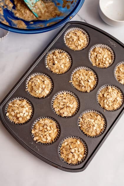 Sprinkle brown sugar and oats on top of apple bran muffins before baking.