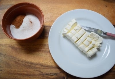 Stir together cinnamon sugar, cut cream cheese.