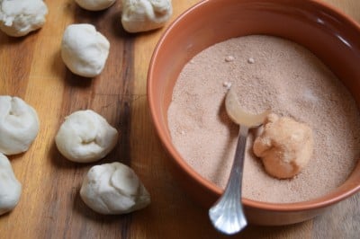 Roll balls in cinnamon sugar.