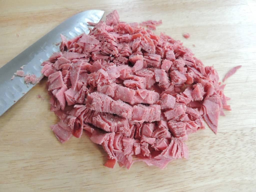Chop corned beef into small pieces.