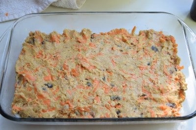 Pat carrot cake bar batter into a greased baking dish.