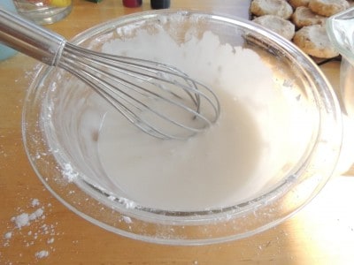 Mix confectioners sugar, extract, and water together to make icing.
