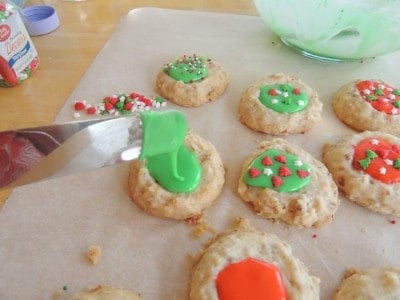 Add icing to thumbprint before adding sprinkles.
