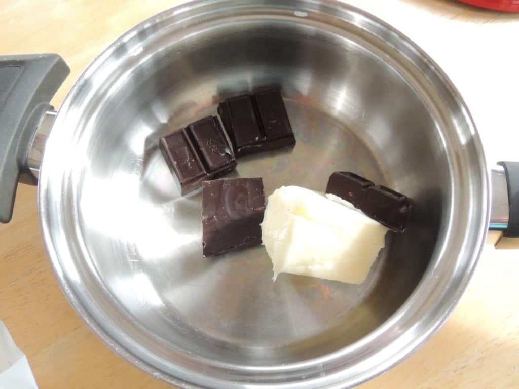 To make icing, melt butter and chocolate in a saucepan.