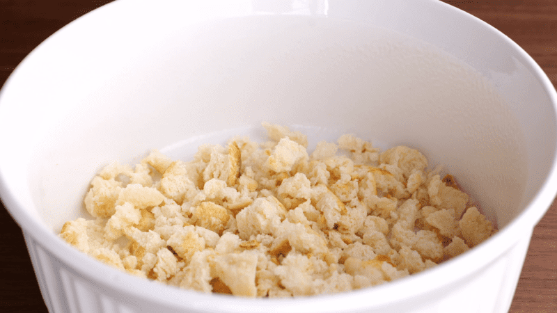 Crumbled biscuits in bowl.