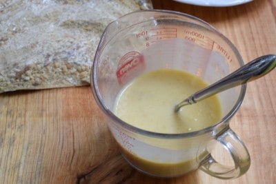 Stir together milk and cream of chicken soup.