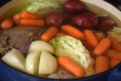 Place veggies in pot with corned beef.