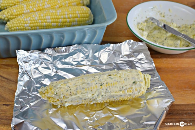 Coat ears of corn in herb butter and wrap individually in foil.