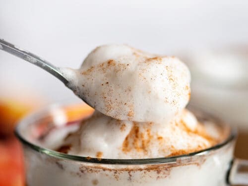 Spoonful of froth on top of sugar-free pumpkin spice latte.