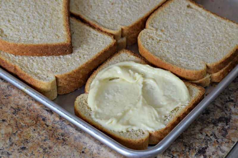 spread cream cheese mixture on bread slices.