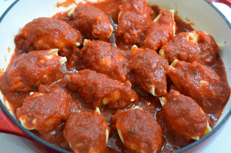 Cover shells with more marinara sauce and bake.