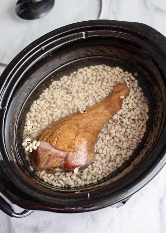 Add water to slow cooker so it covers everything.