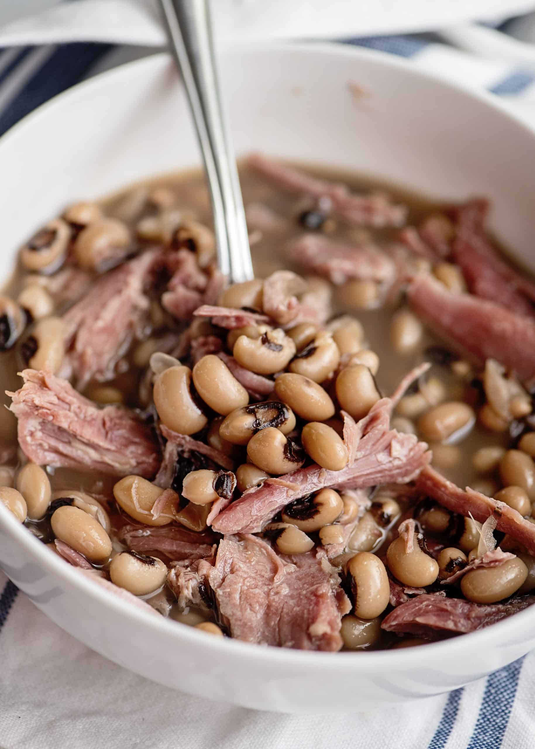 Bowl of crock pot Black Eyed Peas and smoked turkey.