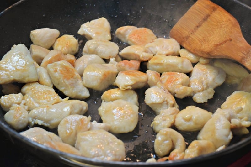 Brown chicken in skillet.