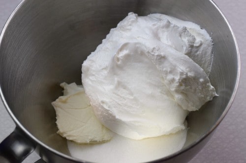 In a mixing bowl, combine cream cheese, sugar, and whipped topping.