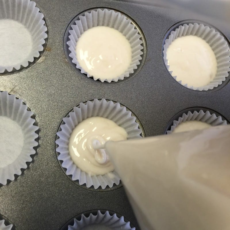 Prepare cake mix according to package and pour batter into cupcake papers.