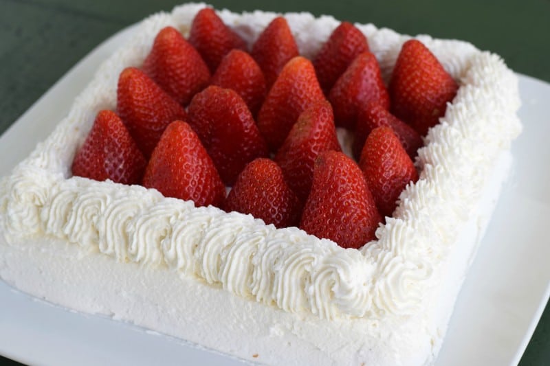 Add strawberries to center of cake.