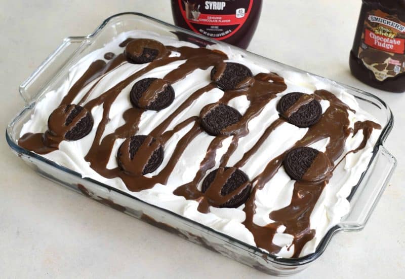 Add whipped topping, Oreos, and magic shell to the top.