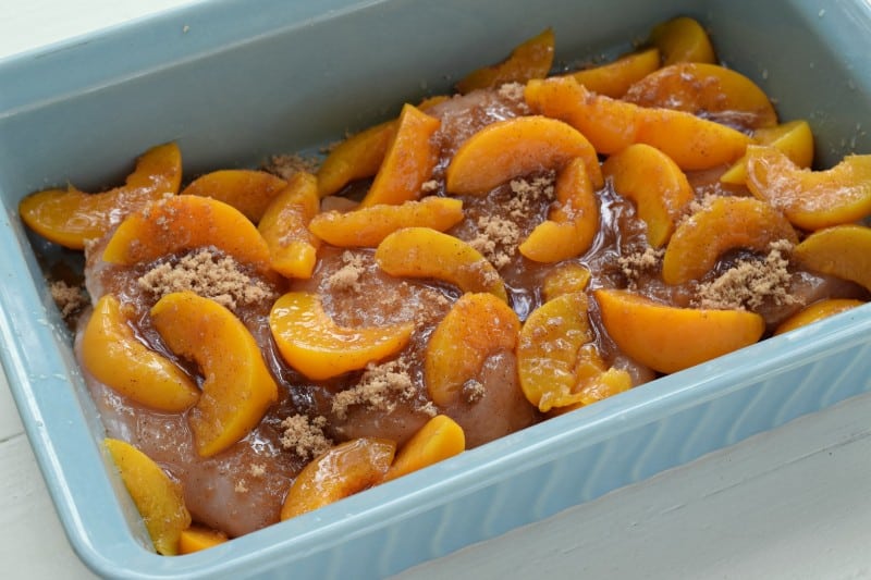 cover chicken with seasonings in greased baking dish.