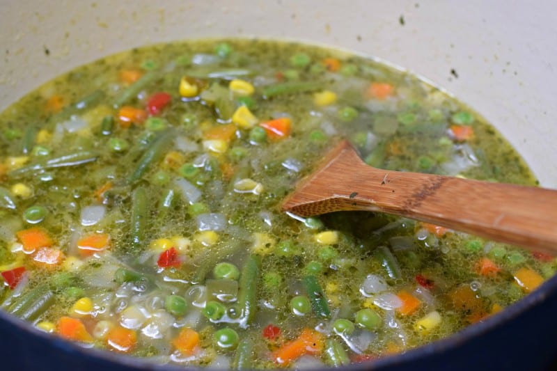 Add frozen vegetables and broth to skillet and cook until tender.