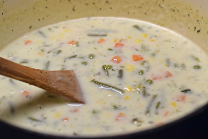 Add heavy cream and salt and pepper to skillet.