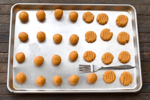 Place balls on baking sheet and flatten with fork.