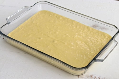 Prepare cake mix according to package directions and pour batter into baking dish.