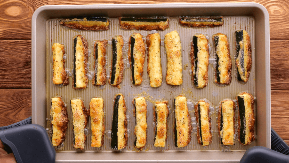 Tray of baked zucchini fries straight out of the oven.