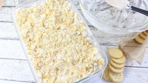 Add ingredients to casserole dish and top with crackers.