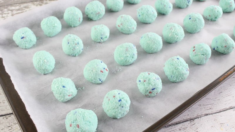 Roll cake into balls and place on lined baking sheet.