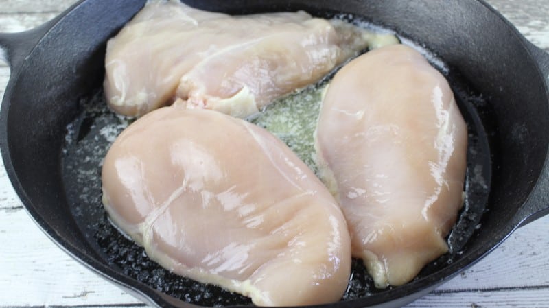 Melt butter in skillet and cook chicken.
