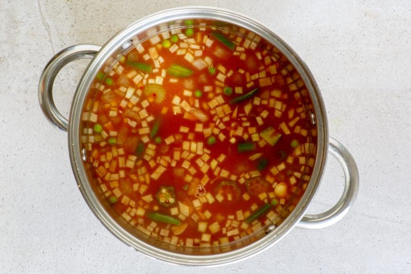 Add remaining ingredients to stockpot and bring to a boil then simmer.