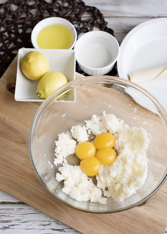 Cream together butter and sugar, then beat in egg yolks.