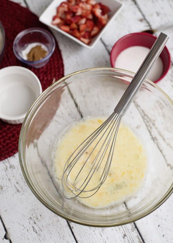 In a bowl, mix together the oil, vanilla, milk, and egg.