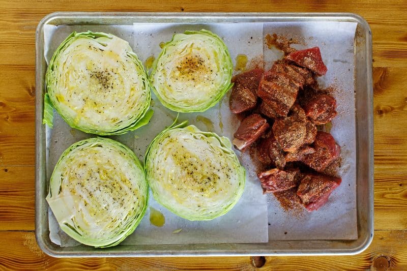Place cabbage and beef on baking sheet and drizzle with oil.