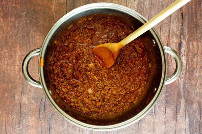 Cook ground beef and onion in saucepot.