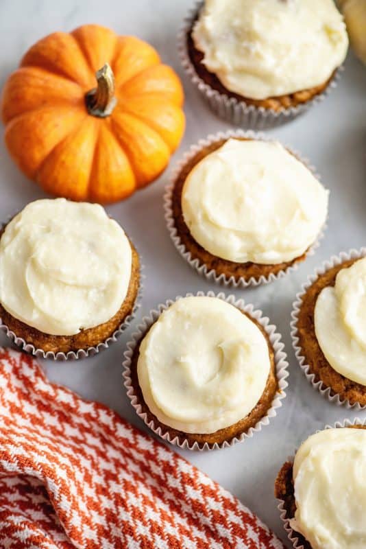 Pumpkin spice cupcakes with cream cheese frosting.