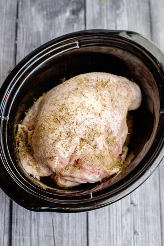 Spread seasonings over turkey breast.