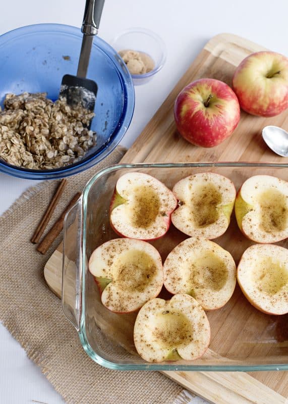 Place apple halves in baking dish and sprinkle with cinnamon.