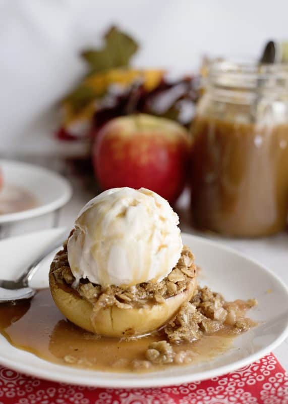Stuffed baked apple with ice cream and caramel sauce.