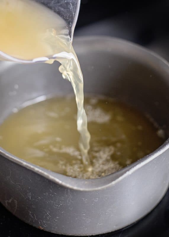 Bring broth to simmer over medium-high heat.
