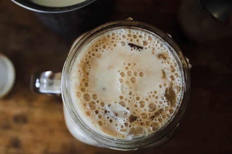 Coffee-flavored ice cubes in a glass of iced coffee.