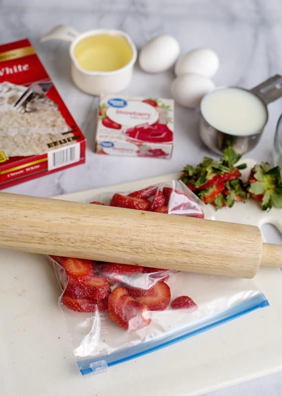 Mashing Strawberries for Fresh Strawberry Cake