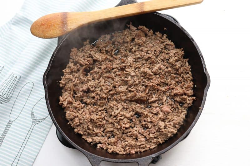 Brown ground beef in skillet.