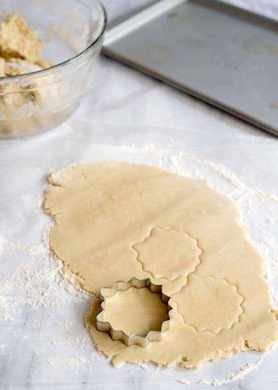 Cut out tea cakes from dough using a cookie cutter.
